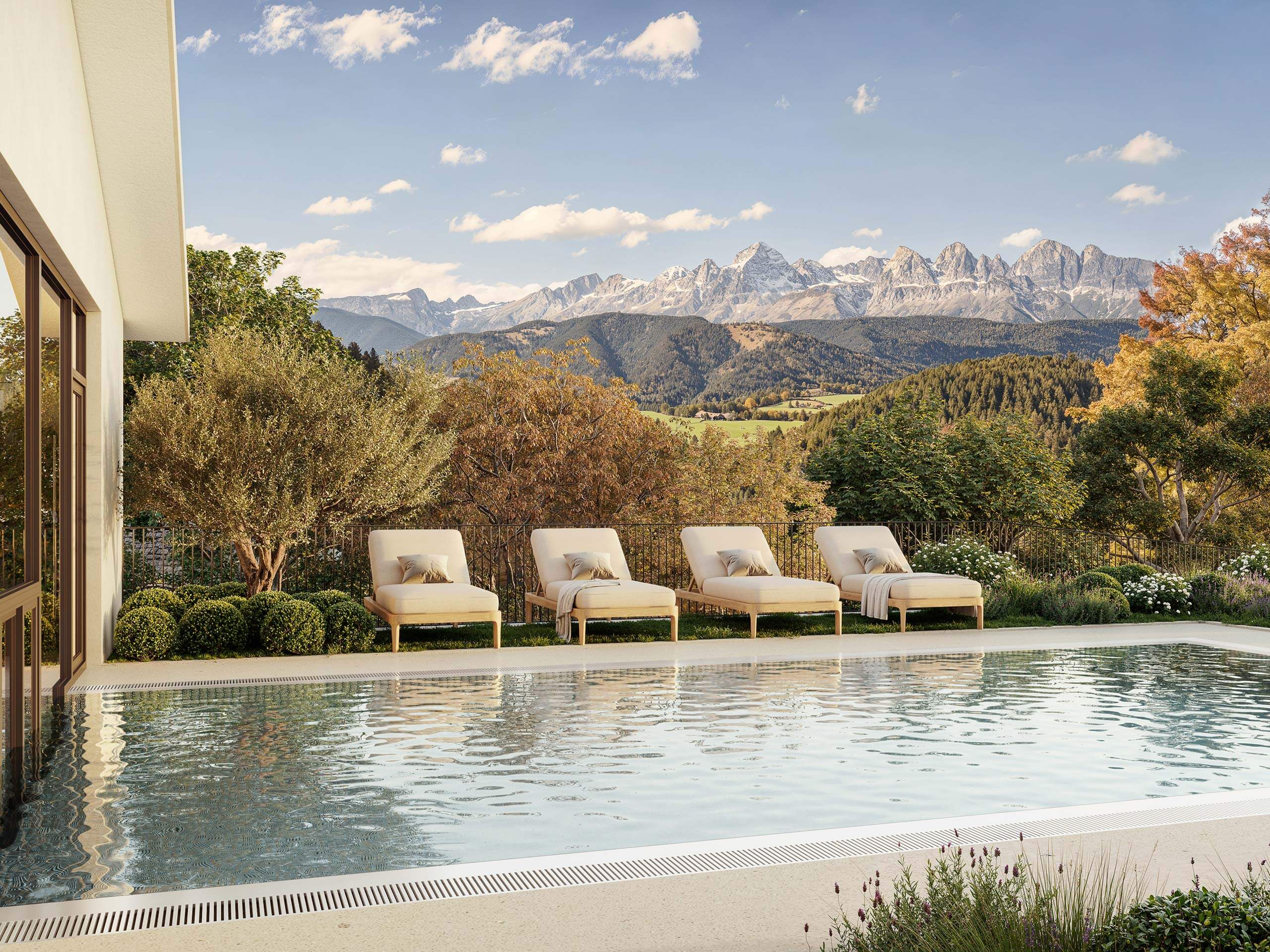 Serene pool with mountain backdrop at Ganis Resort Dolomites