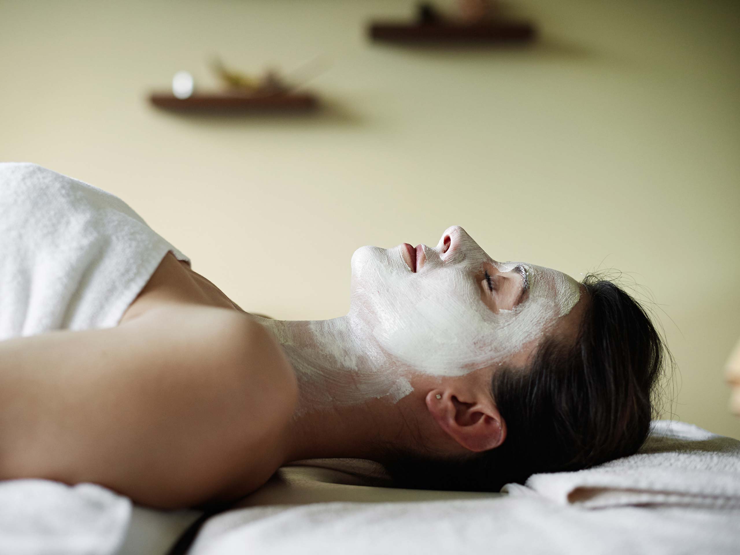 Woman receiving facial treatment in spa at Ganis Resort Dolomites